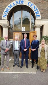 4 fomer principals and current principal standing outside